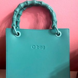 Brand new obag brand bag with pieces to change handles, comes with dust bag.